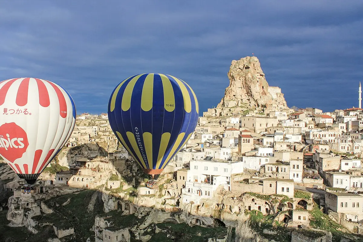 Hot air balloons over the rock valleys of Cappadocia at sunrise